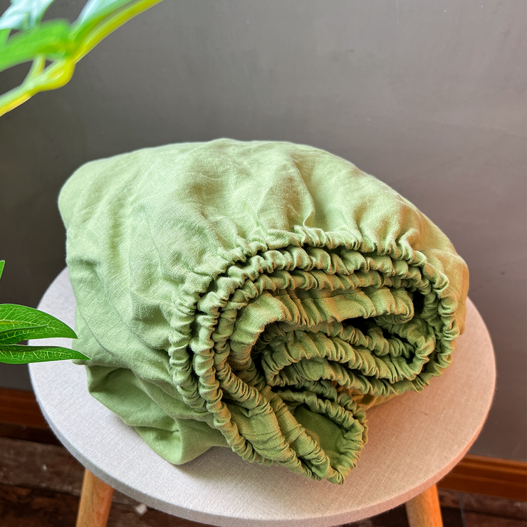 Green Tea Fitted Sheet Folded on Chair - linenshed US