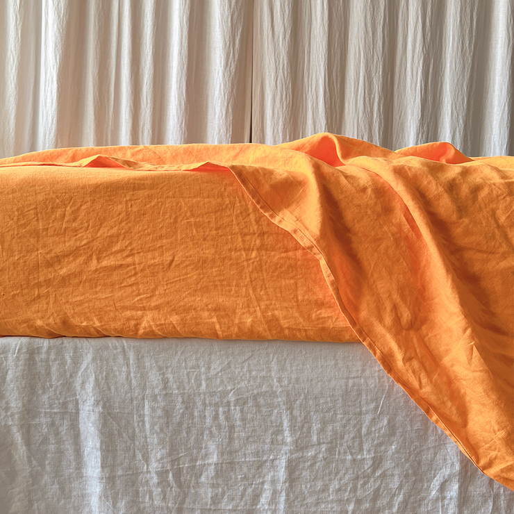 Small Edge Detail Of Orange Bed Linen Top Sheet - linenshed USA